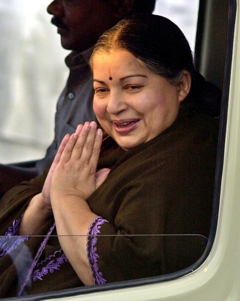 Tamil Nadu Chief Minister and All India Anna Dravida Munnetra Kazhagam (AIADMK) General Secretary J. Jayalalithaa, greets supporters as she arrives for a political rally in Madras, India, Tuesday, March 9, 2004. Indian general elections, which will determine India's leadership for the next five years, will be held in four rounds, beginning April 20 and ending May 10, 2004. (AP Photo/M.Lakshman)