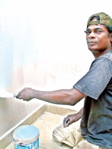 Ramesh painting at a house